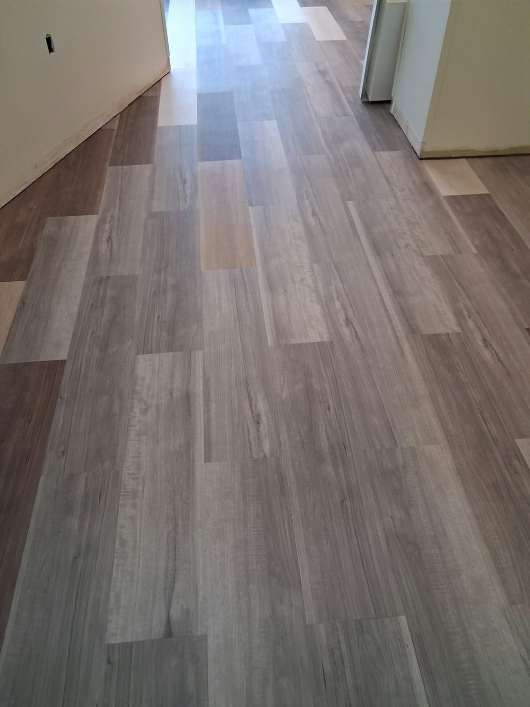 Flooring fitted around interior wall
